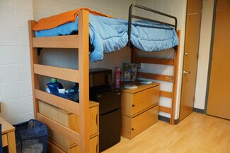 ISR Double Room lofted bed with fridge and dresser underneath