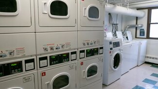 Laundry room with dryers and washers