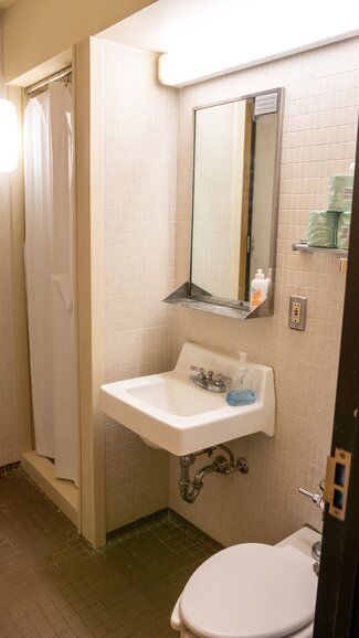 Sherman suite bathroom with shower, sink, mirror and toilet