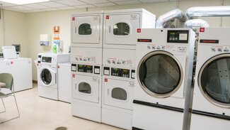 Laundry room with washers and dryers