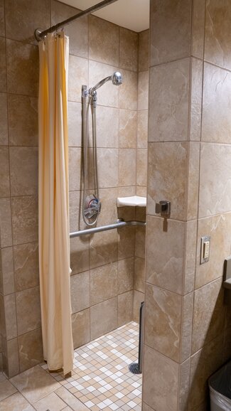 Accessible single occupancy bathroom with shower