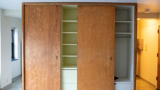 Large closet with sliding wood doors