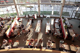 SDRP Dining hall with tables, chair and students eating
