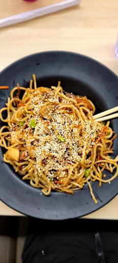 photo of stir fry with long noodles and vegetables