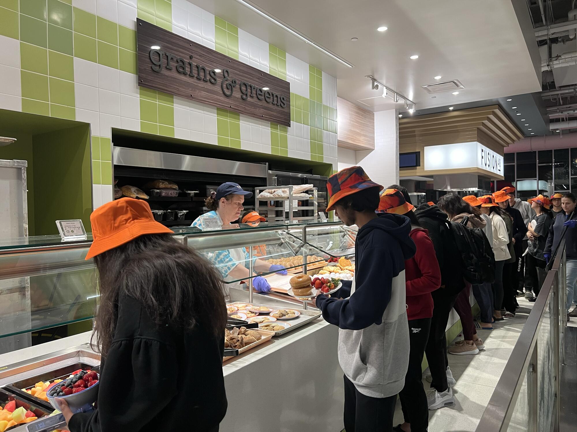 students in line at Grains and Greens micro-restaurant at ISR