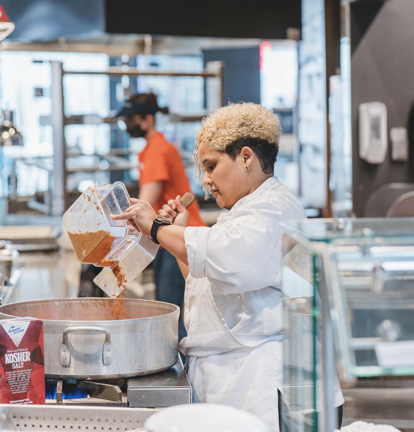 Chef Crystol Smith prepares food in University Housing dining halls.